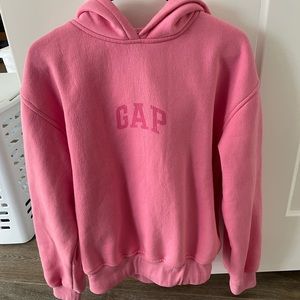 Size large, pink hoodie with GAP logo on it.